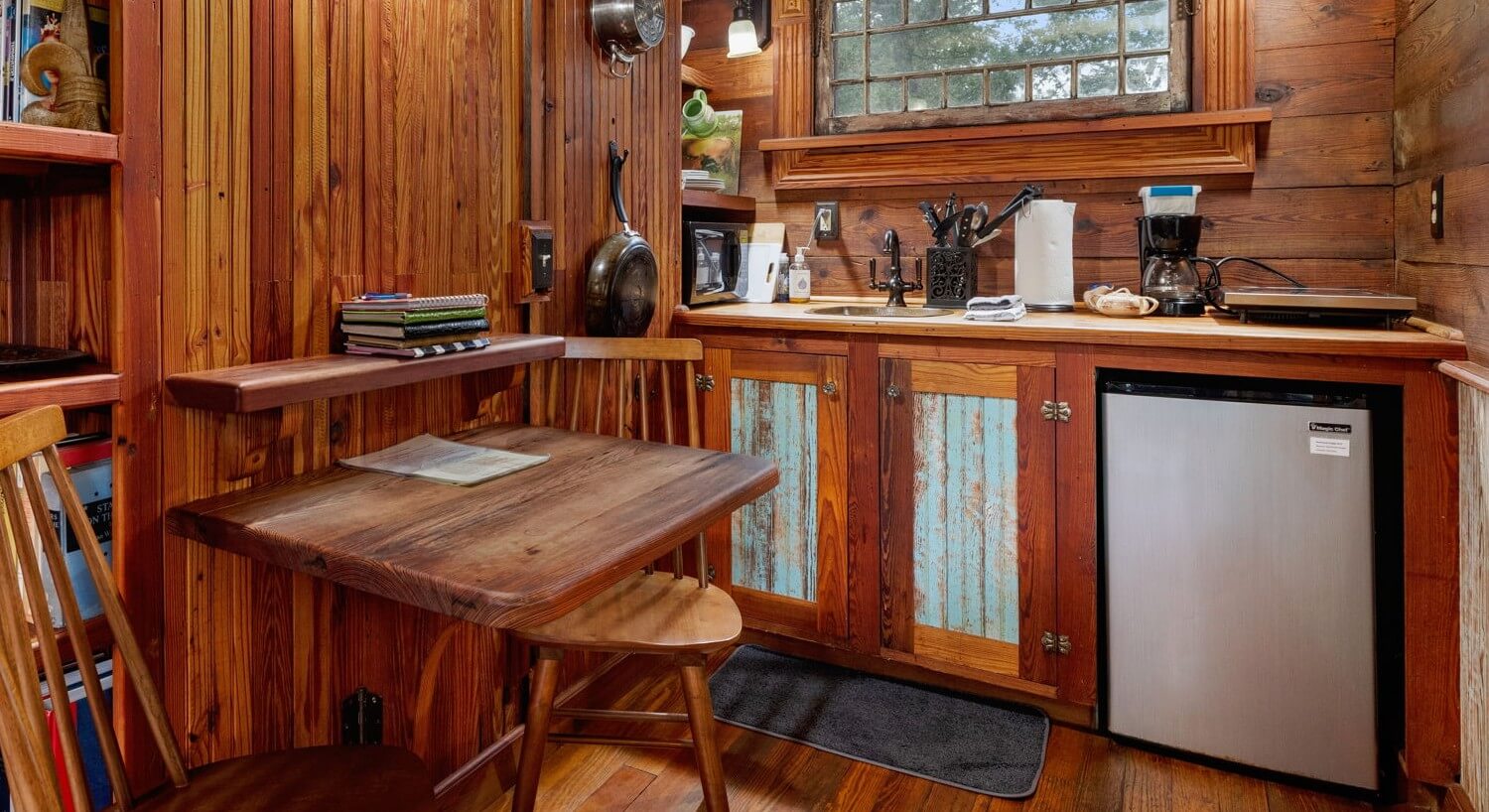 Small kitchen area with two chairs.