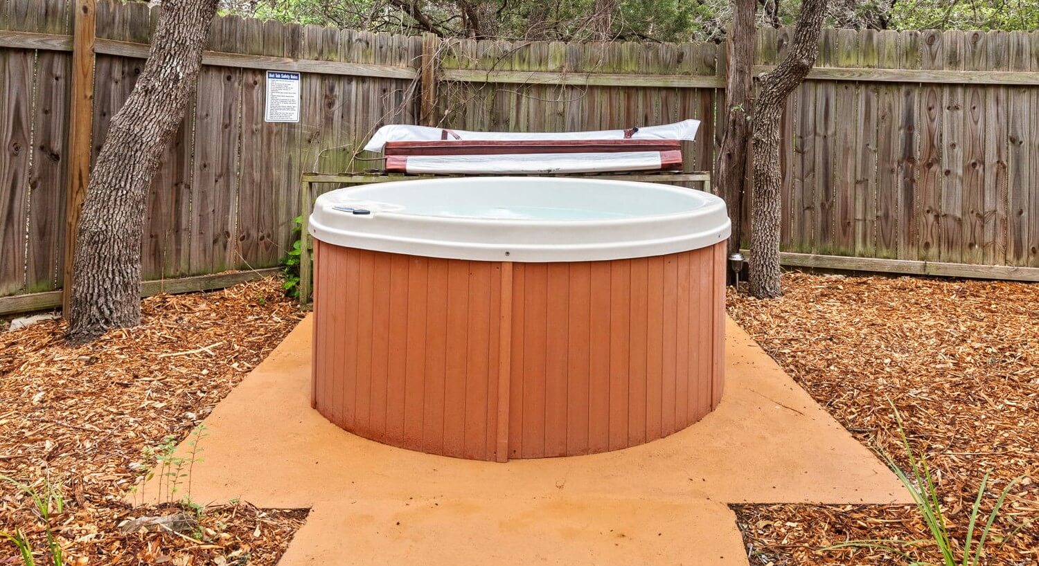 Hot tub in a fenced garden.